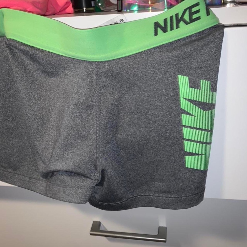 Nike pros with green logo and waistband size small